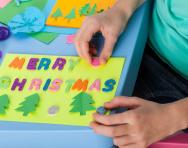Child making a Christmas card