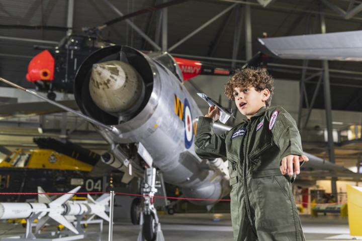 Young boy with plane ©️ IWM Duxford