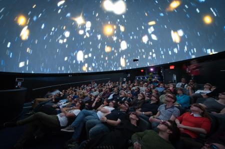 Group of people inside the planetarium 