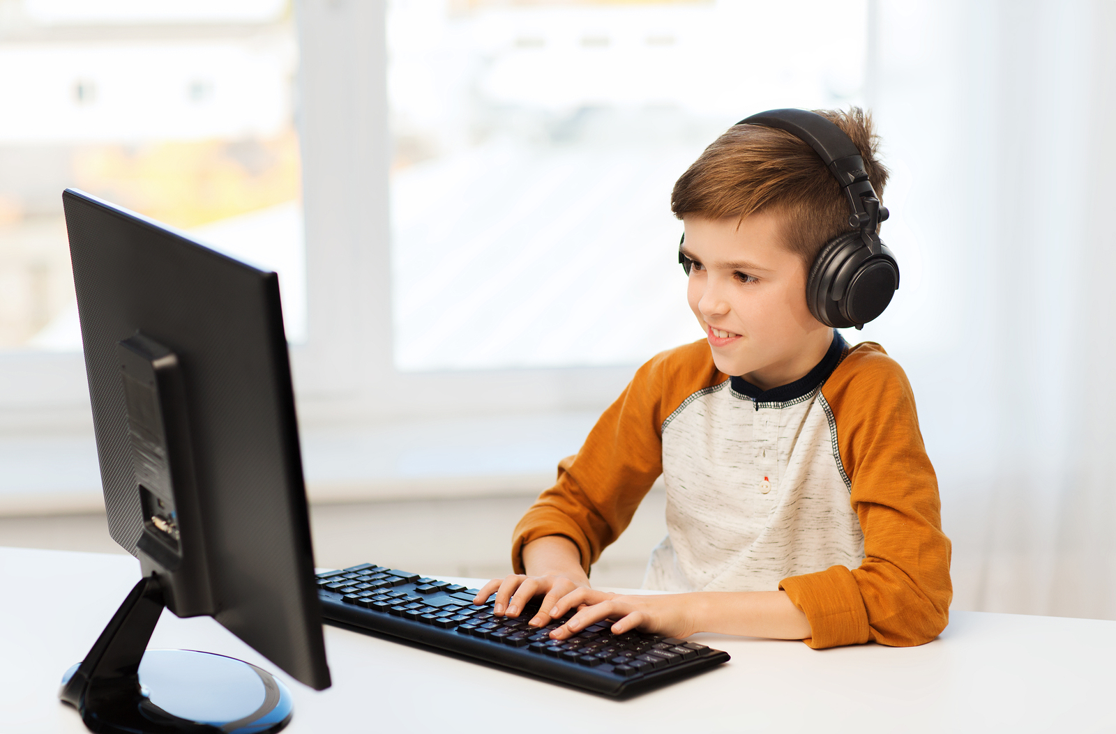 kid playing computer