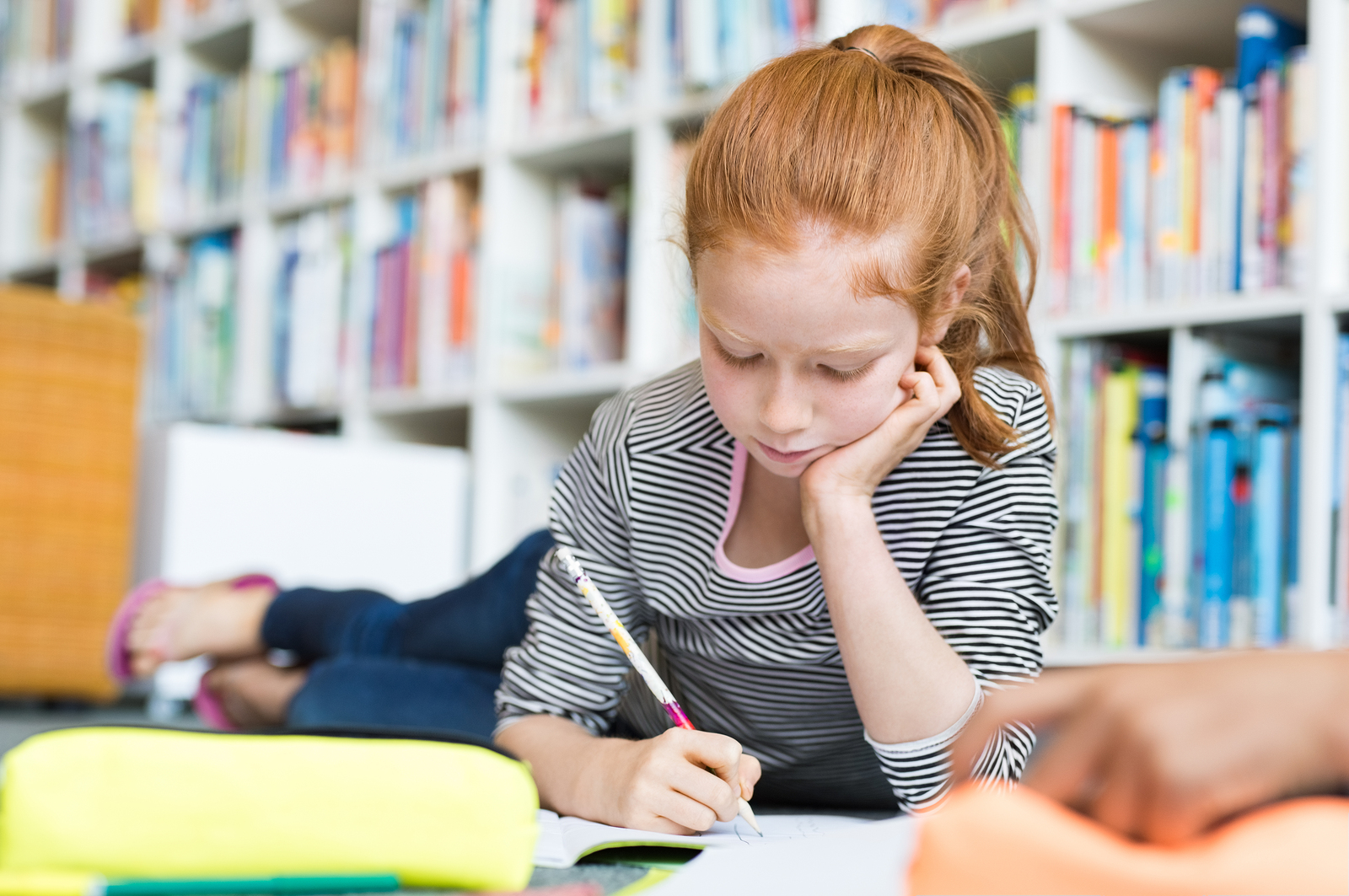 child writing a book review