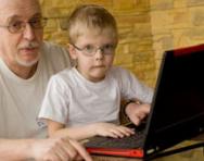 Boy and his grandad both wearing glasses Boy and his grandad both wearing glasses