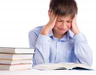 Boy crying over book Boy crying over book