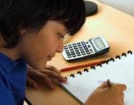 Boy doing maths work Boy doing maths work