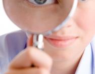 Boy looking through a magnifying glass Boy looking through a magnifying glass