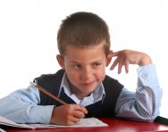Boy thinking in class Boy thinking in class