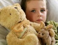 Boy with teddy in bed Boy with teddy in bed