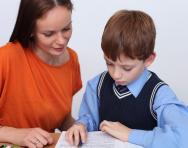 Child and tutor working together Child and tutor working together