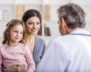 Child and mother speaking to doctor Child and mother speaking to doctor