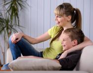 Child and parent watching TV - best educational TV shows for KS2 Child and parent watching TV - best educational TV shows for KS2