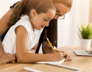 Child and parent writing Child and parent writing