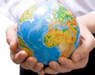 Child holding globe Child holding globe