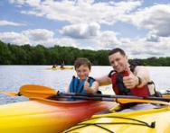 Child learning to canoe Child learning to canoe