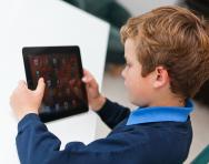 Child looking at tablet computer Child looking at tablet computer