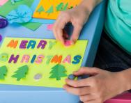Child making a Christmas card Child making a Christmas card