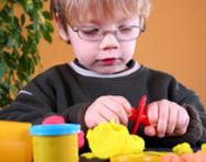 Child playing with playdough Child playing with playdough
