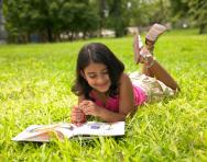 Child reading maths story book Child reading maths story book