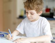 Child writing at home Child writing at home