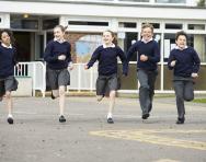 Children running in the playground Children running in the playground