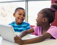Children using a tablet computer Children using a tablet computer