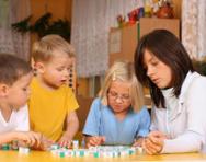 Family playing spelling game Family playing spelling game