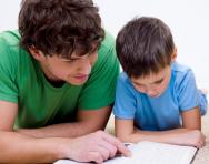Father and son reading together Father and son reading together