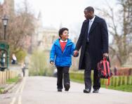 Father and son walking to school Father and son walking to school