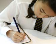 Girl doing times tables homework Girl doing times tables homework