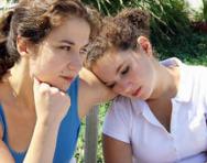 Girl consoling her upset friend Girl consoling her upset friend