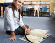 Girl reading in the library Girl reading in the library