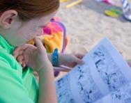 Girl reading on the beach Girl reading on the beach