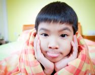 Child awake in bed Child awake in bed