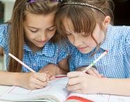 Schoolgirls writing Schoolgirls writing