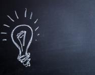 Light bulb on blackboard Light bulb on blackboard
