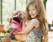 Little girl watering plants Little girl watering plants