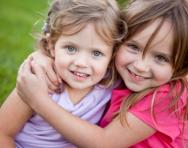Little girls hugging Little girls hugging