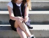 Little school girl tying shoelaces Little school girl tying shoelaces