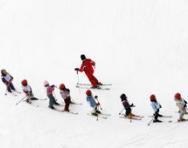 Lots of children skiing Lots of children skiing