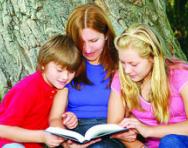 Mum reading to son and daughter Mum reading to son and daughter