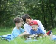 Nanny reading book to children Nanny reading book to children