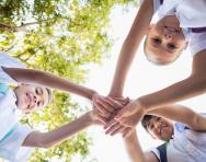 Schoolchildren stacking hands Schoolchildren stacking hands