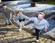 Children playing outdoors in the snow Children playing outdoors in the snow