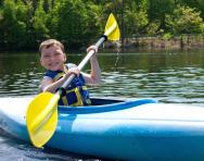 Summer camp boy kayaking Summer camp boy kayaking