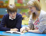 Teacher and pupil reading Teacher and pupil reading
