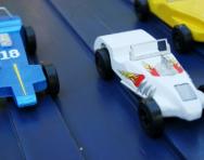 Toy cars going down a slope Toy cars going down a slope