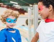 Two boys playing in costume Children in cheap, easy costumes