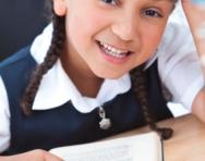 Girl reading at her desk Girl reading at her desk