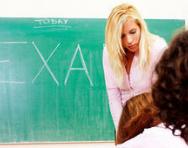 School blackboard saying exam School blackboard saying exam