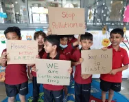 Earth Warrior image of children with signs Earth Warrior image of children with signs