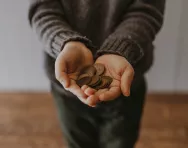 Child with money in hands Child with money in hands